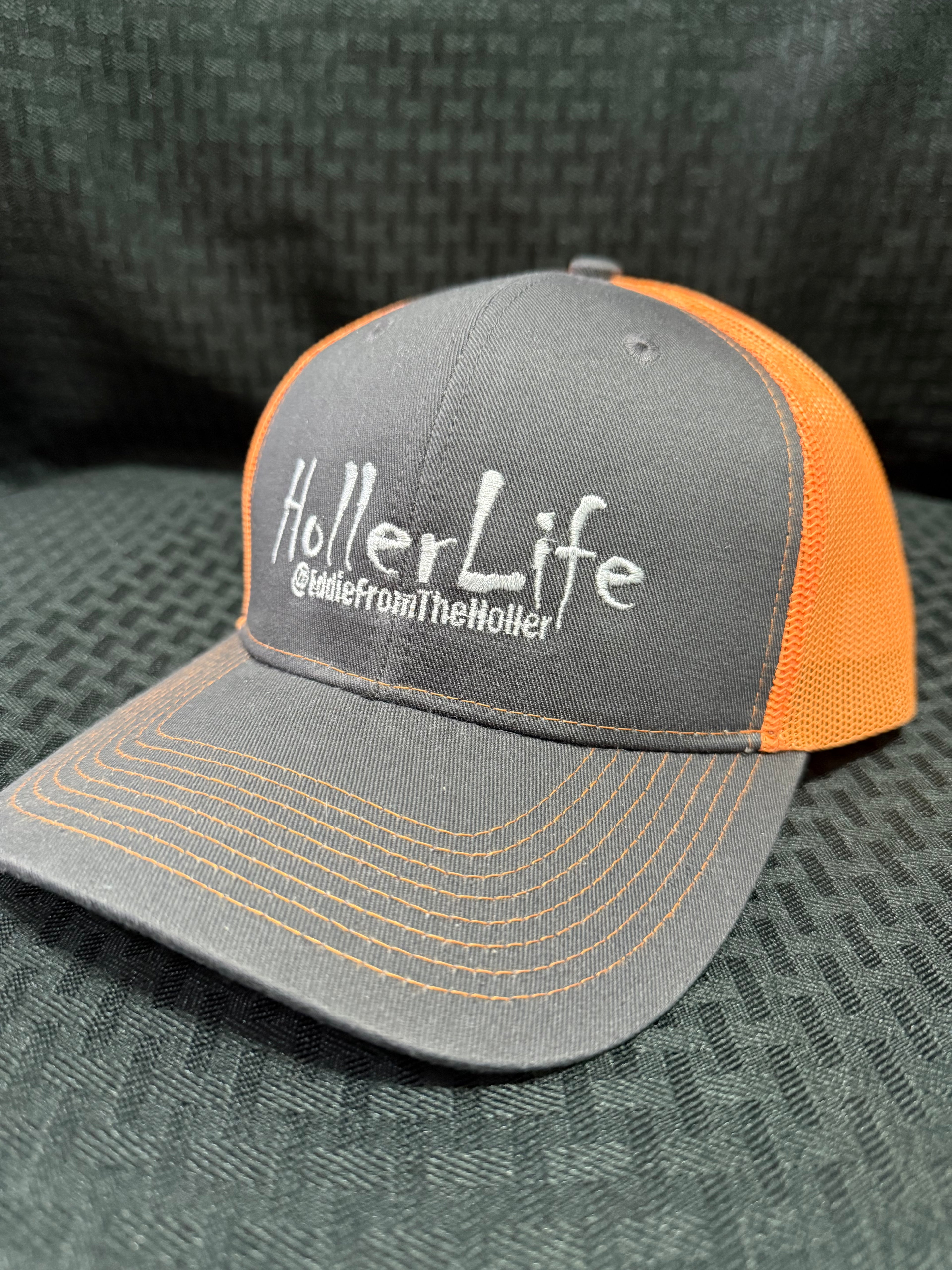 Dark gray with fluorescent orange mesh back cap
