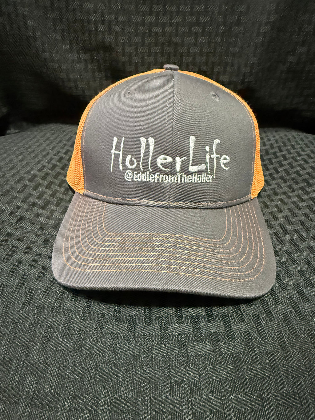 Dark gray with fluorescent orange mesh back cap