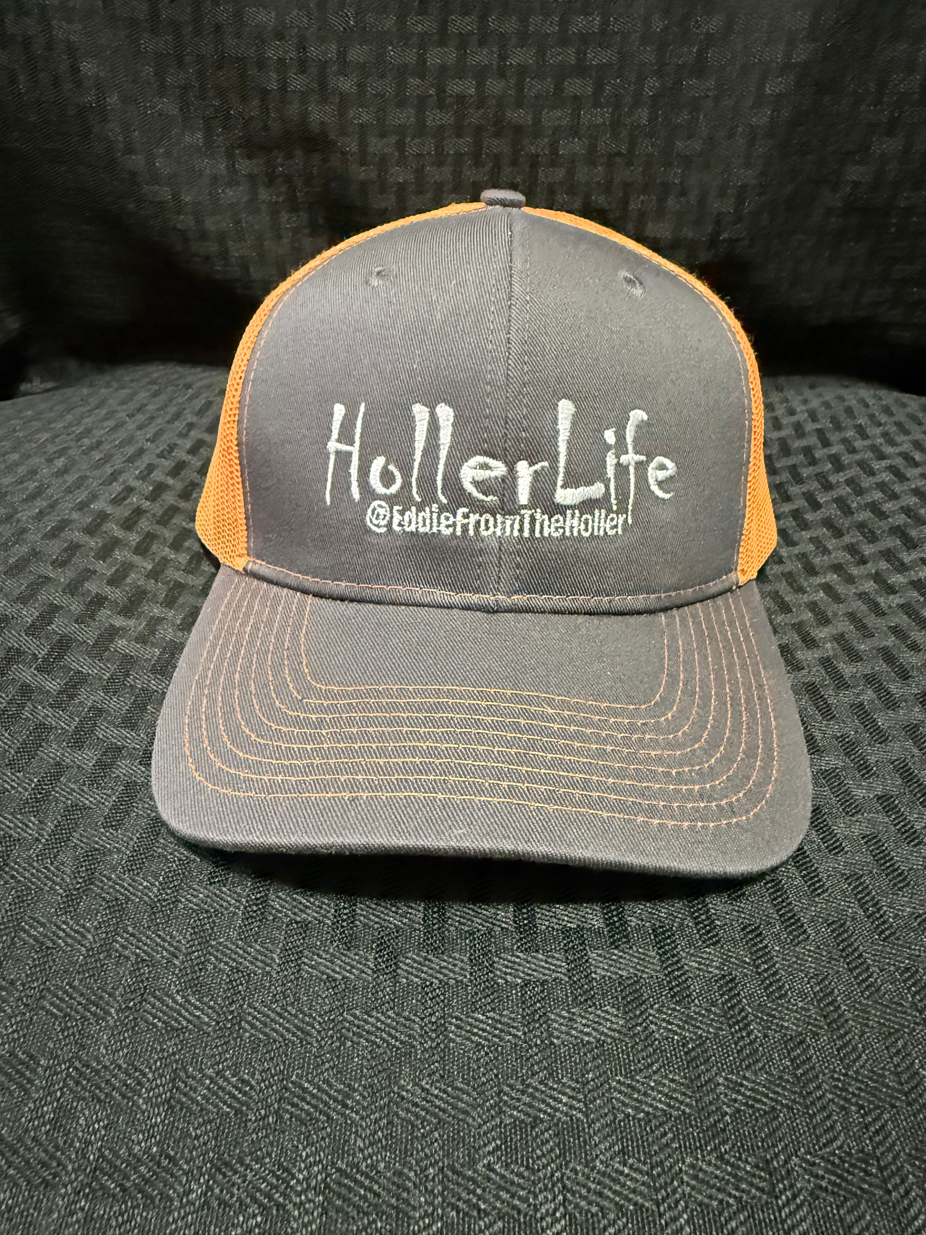 Dark gray with fluorescent orange mesh back cap